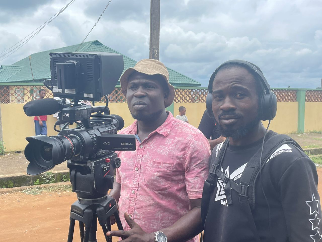 Camera operator and sound recordist with a JVC 4K camera on location