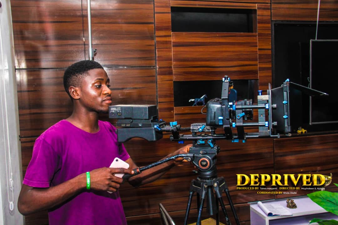 Camera operator running a rig on the set of the film Deprived