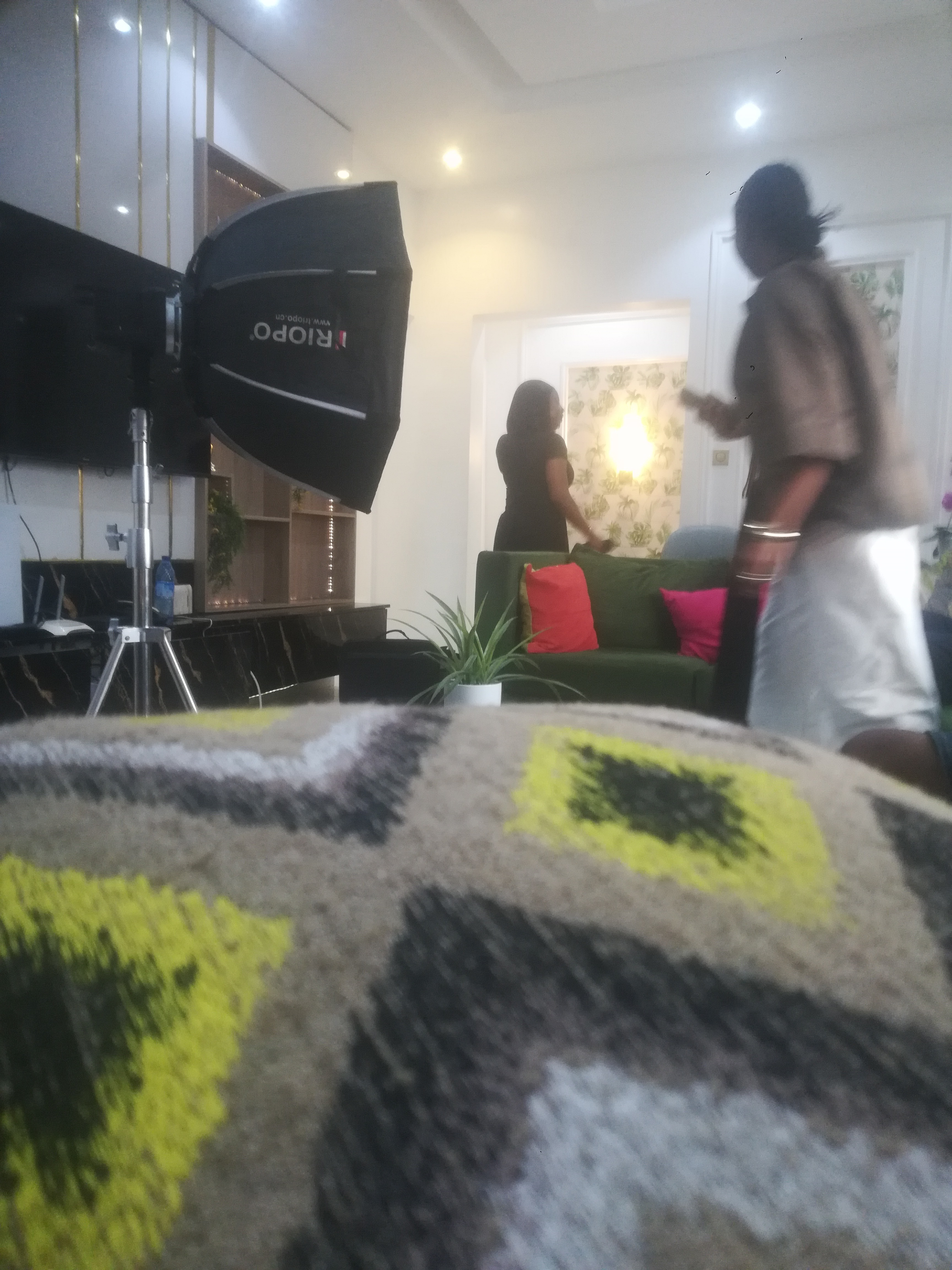 Interior film set lit with a softbox during a living-room scene